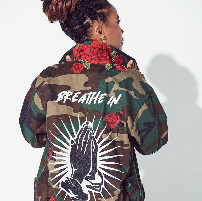 Camo jacket with store writing on back